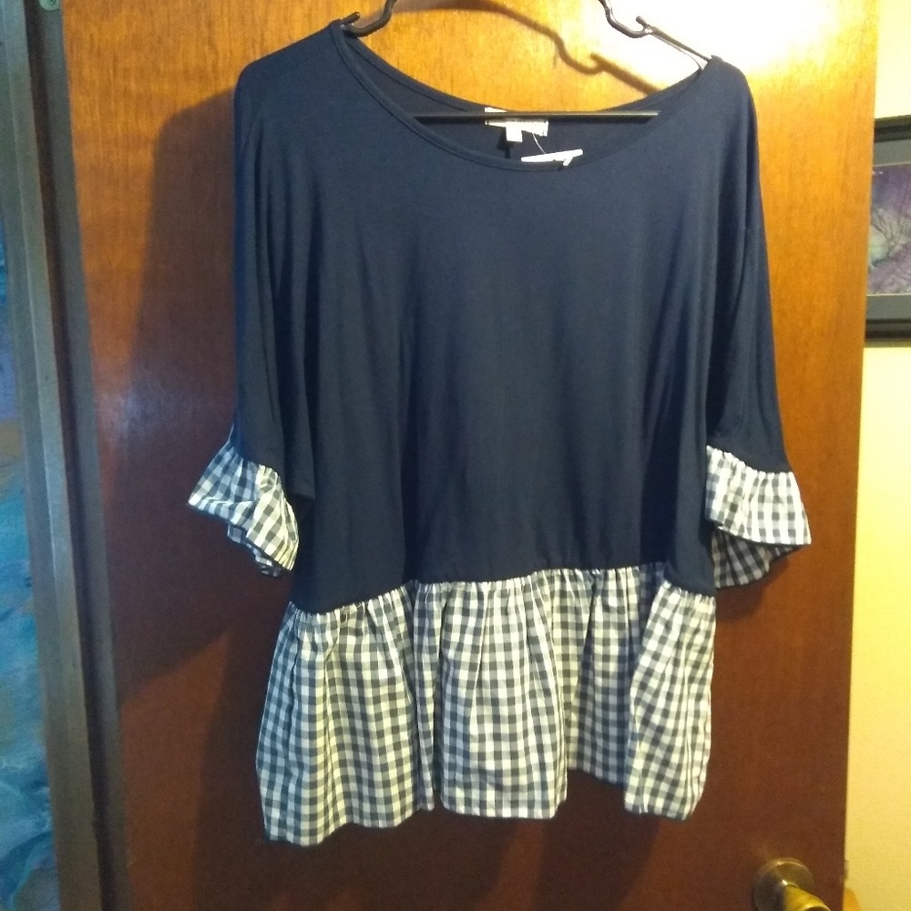 Navy shirt with gingham trim.